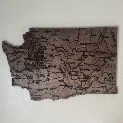 Wooden map of Washington state on a white wall